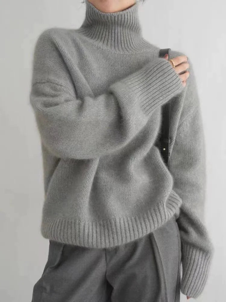 https://cdn.shopify.com/s/files/1/0646/0555/2908/files/Knit-Sweater-Turtleneck-Style-Relaxed-Fit-with-Ribbed-Details-3.webp?v=1745639140