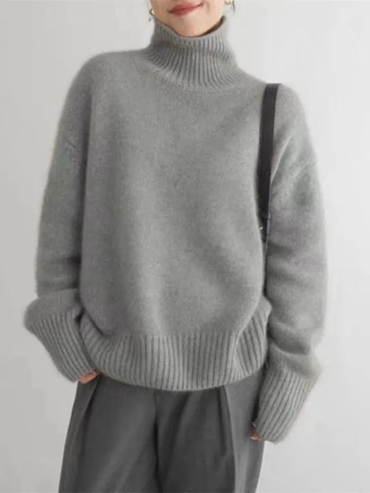 https://cdn.shopify.com/s/files/1/0646/0555/2908/files/Knit-Sweater-Turtleneck-Style-Relaxed-Fit-with-Ribbed-Details-4.webp?v=1745639140