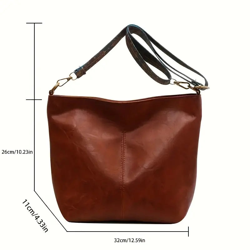 https://cdn.shopify.com/s/files/1/0646/0555/2908/files/Spacious-Hobo-Bag-Adjustable-Strap-Roomy-Interior-5.webp?v=1745638959
