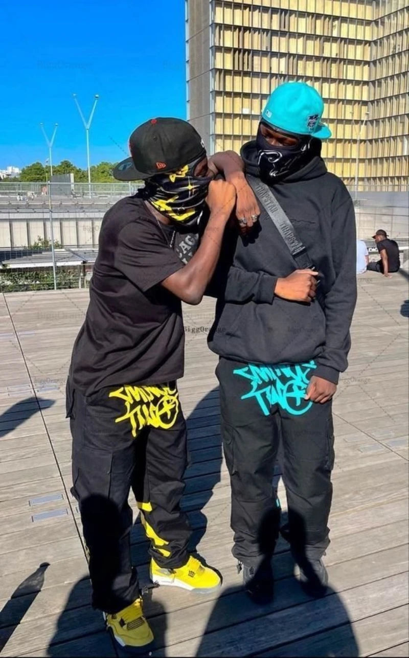https://cdn.shopify.com/s/files/1/0646/0555/2908/files/Streetwear-Pants-and-Hoodie-Set-Relaxed-Fit-Urban-Style-3.jpg?v=1745639187