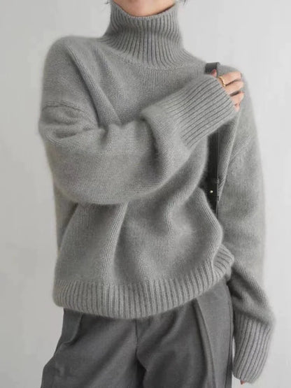 https://cdn.shopify.com/s/files/1/0646/0555/2908/files/Knit-Sweater-Turtleneck-Style-Relaxed-Fit-with-Ribbed-Details-3.webp?v=1745639140