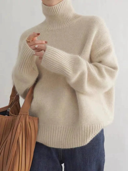 https://cdn.shopify.com/s/files/1/0646/0555/2908/files/Knit-Sweater-Turtleneck-Style-Relaxed-Fit-with-Ribbed-Details.webp?v=1745639140